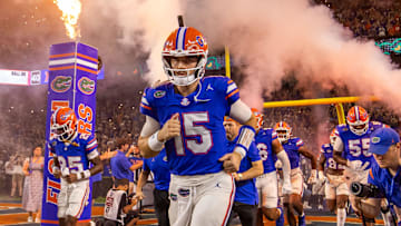 Florida Gators quarterback Graham Mertz (15) runs out of the tunnel with the team as fireworks and fire shoot out of towers before the start of the game at Ben Hill Griffin Stadium in Gainesville, FL on Saturday, October 5, 2024