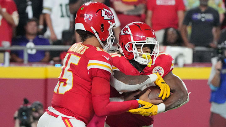 Kansas City Chiefs quarterback Patrick Mahomes hands the ball off to running back Isiah Pacheco against the Baltimore Ravens.