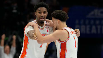 Mar 13, 2025; Charlotte, NC, USA; Clemson Tigers forward Chauncey Wiggins (7) and guard Chase Hunter (1) react in the second half at Spectrum Center. Mandatory Credit: Bob Donnan-Imagn Images