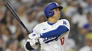 Sep 6, 2024; Los Angeles, California, USA;  Los Angeles Dodgers designated hitter Shohei Ohtani (17) singles in the eighth inning against the Cleveland Guardians at Dodger Stadium. Mandatory Credit: Jayne Kamin-Oncea-Imagn Images