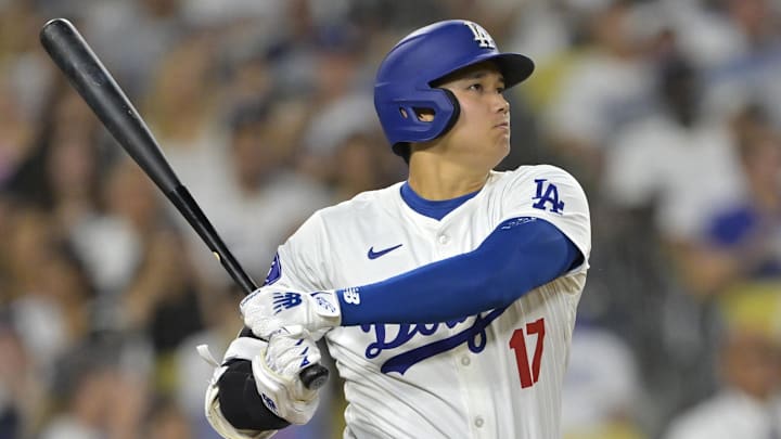 Sep 6, 2024; Los Angeles, California, USA;  Los Angeles Dodgers designated hitter Shohei Ohtani (17) singles in the eighth inning against the Cleveland Guardians at Dodger Stadium. Mandatory Credit: Jayne Kamin-Oncea-Imagn Images