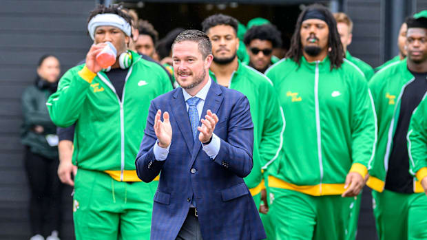 Oregon Ducks head coach Dan Lanning leads the team parade before a game against the Washington State Cougars at Autzen Stadiu
