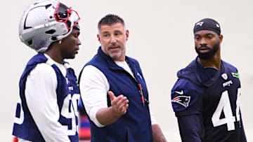 Jun 10, 2025; Foxborough, MA, USA; New England Patriots head coach Mike Vrabel speaks to defensive end Keion White (99) and linebacker K'Lavon Chaisson (44) after minicamp held in the WIN Field House at Gillette Stadium. Mandatory Credit: Eric Canha-Imagn Images
