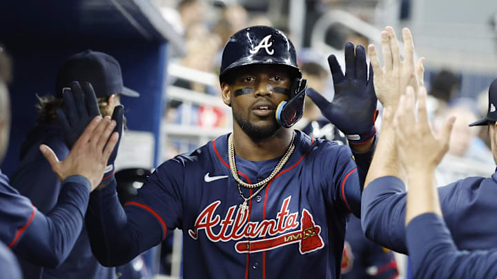Atlanta Braves right fielder Jorge Soler celebrates hitting a home run with his teammates.