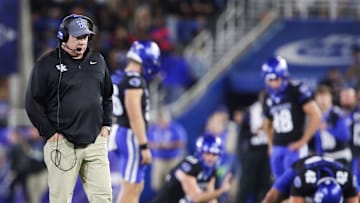 Kentucky head coach Mark Stoops walks the field during a time out as his special teams practice snapping the ball for extra point attempts at Kroger Field Saturday, Oct. 12, 2024 in Lexington, Ky.