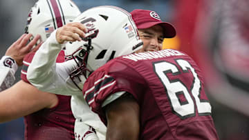 South Carolina football coach with Tyshawn Wannamaker