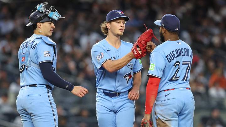 May 21, 2026; Bronx, New York, USA;  Toronto Blue Jays relief pitcher Adam MacKo (64) is greeted by catcher Brandon Valenzuela (59) and first baseman Vladimir Guerrero Jr. (27) after getting taken out of the game in the third inning against the New York Yankees at Yankee Stadium. Mandatory Credit: Wendell Cruz-Imagn Images