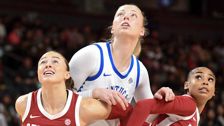 Arkansas Razorbacks guard Bonnie Deas (22) and Arkansas Razorbacks guard Taleyah Jones (10) box out Kentucky Wildcats center Clara Strack (13) Wednesday, March 4, 2026, during the SEC Women's Basketball Tournament first round game at Bon Secours Wellness Arena in Greenville, South Carolina.