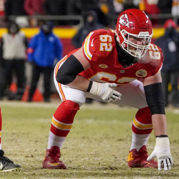 Jan 13, 2024; Kansas City, Missouri, USA; Kansas City Chiefs center Creed Humphrey (52) and guard Joe Thuney (62) at the line of scrimmage against the Miami Dolphins in a 2024 AFC wild card game at GEHA Field at Arrowhead Stadium. Mandatory Credit: Denny Medley-USA TODAY Sports
