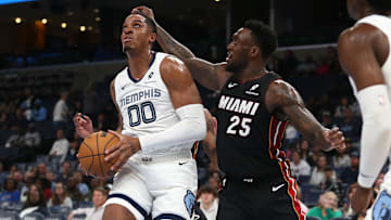 Oct 18, 2024; Memphis, Tennessee, USA; Memphis Grizzlies forward Armando Bacot (00) drives to the basket as Miami Heat forward Nassir Little (25) defends during the second half at FedExForum. Mandatory Credit: Petre Thomas-Imagn Images