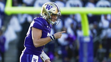 Oct 5, 2024; Seattle, Washington, USA; Washington Huskies quarterback Will Rogers (7) celebrates after throwing a touchdown pass against the Michigan Wolverines during the second quarter at Alaska Airlines Field at Husky Stadium. Mandatory Credit: Joe Nicholson-Imagn Images