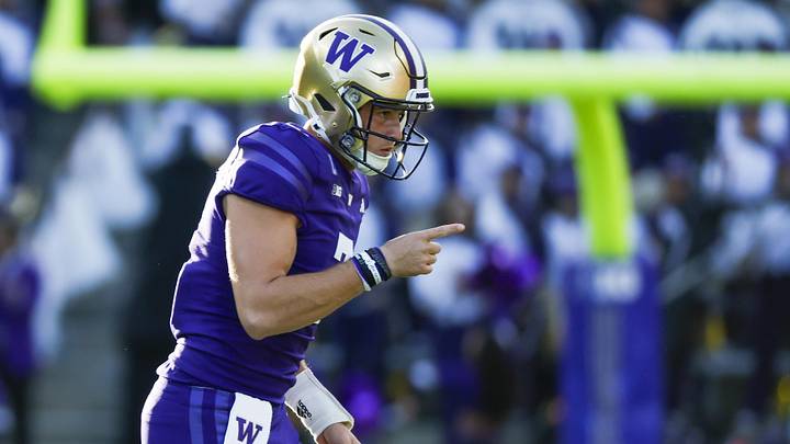 Oct 5, 2024; Seattle, Washington, USA; Washington Huskies quarterback Will Rogers (7) celebrates after throwing a touchdown pass against the Michigan Wolverines during the second quarter at Alaska Airlines Field at Husky Stadium. Mandatory Credit: Joe Nicholson-Imagn Images