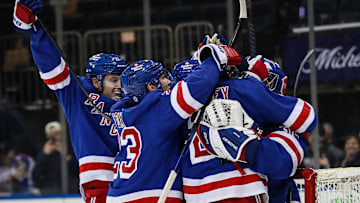 Feb 2, 2025; New York, New York, USA; New York Rangers goalie Jonathan Quick (32) celebrates his 400th career win after a 4-2 victory against the Vegas Golden Knights at Madison Square Garden. Mandatory Credit: Danny Wild-Imagn Images