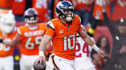 Oct 19, 2025; Denver, Colorado, USA; Denver Broncos quarterback Bo Nix (10) celebrates after play during the second half against the New York Giants at Empower Field at Mile High. Mandatory Credit: Ron Chenoy-Imagn Images