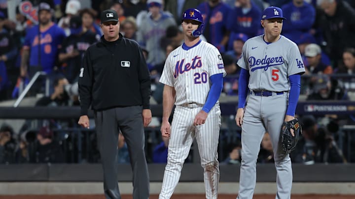 Oct 18, 2024; New York City, New York, USA; New York Mets first base Pete Alonso (20) reacts at first base with Los Angeles Dodgers first base Freddie Freeman (5) in the eighth inning during game five of the NLCS for the 2024 MLB playoffs at Citi Field. Mandatory Credit: Brad Penner-Imagn Images Oct 18, 2024; New York City, New York, USA; New York Mets first base Pete Alonso (20) reacts at first base with Los Angeles Dodgers first base Freddie Freeman (5) in the eighth inning during game five of the NLCS for the 2024 MLB playoffs at Citi Field. Mandatory Credit: Brad Penner-Imagn Images