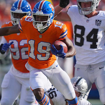Oct 6, 2024; Denver, Colorado, USA; Denver Broncos wide receiver Marvin Mims Jr. (19) during a kickoff return in the second half against the Las Vegas Raiders at Empower Field at Mile High. 