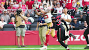 Nov 16, 2025; Glendale, Arizona, USA; San Francisco 49ers tight end George Kittle (85) catches a pass for a touchdown in the first quarter against the Arizona Cardinals at State Farm Stadium. Mandatory Credit: Joe Camporeale-Imagn Images