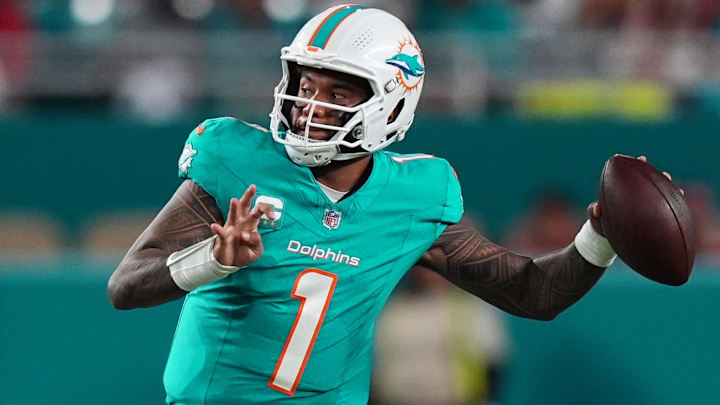 Dec 22, 2024; Miami Gardens, Florida, USA; Miami Dolphins quarterback Tua Tagovailoa (1) attempts a pass against the San Francisco 49ers during second half at Hard Rock Stadium. Mandatory Credit: Jasen Vinlove-Imagn Images