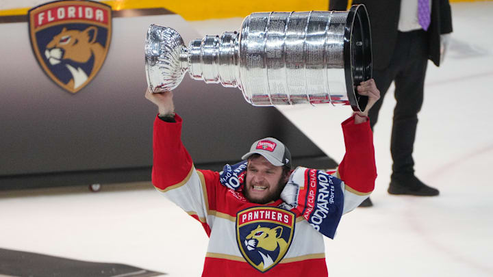 Jun 24, 2024; Sunrise, Florida, USA; Florida Panthers forward Aleksander Barkov (16) hoists the Stanley Cup after defeating Edmonton Oilers in game seven of the 2024 Stanley Cup Final at Amerant Bank Arena. Mandatory Credit: Jim Rassol-Imagn Images