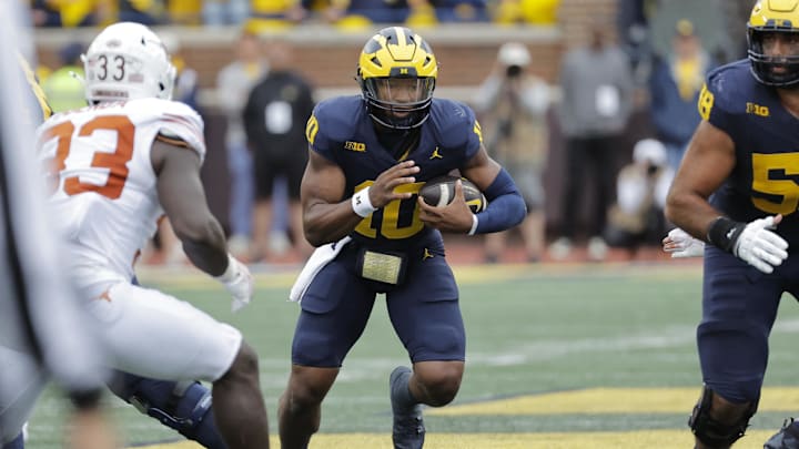 Sep 7, 2024; Ann Arbor, Michigan, USA; Michigan Wolverines quarterback Alex Orji (10) rushes against the Texas Longhorns at Michigan Stadium. Mandatory Credit: Rick Osentoski-Imagn Images