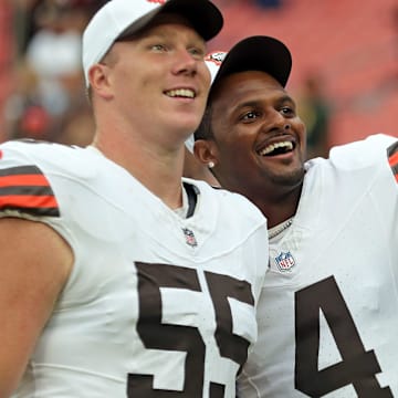 Cleveland Browns center Ethan Pocic (55) and quarterback Deshaun Watson (4) look at the crowd during the second half of an NFL preseason football game at Cleveland Browns Stadium, Saturday, Aug. 10, 2024, in Cleveland, Ohio.