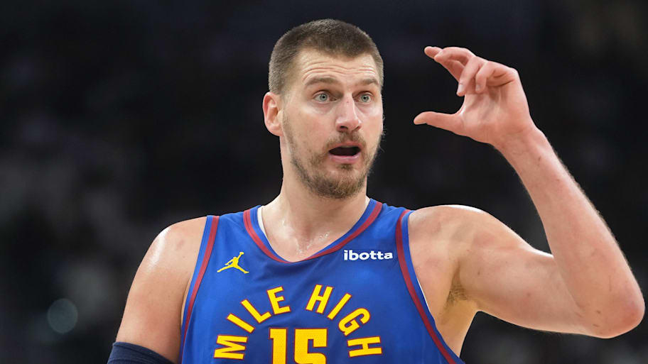 Denver Nuggets center Nikola Jokic signals to teammates against the San Antonio Spurs.