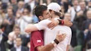 Novak Djokovic and Andy Murray embrace at the net after their match on day 15 of the 2016 French Open. 