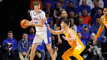 Jan 7, 2025; Gainesville, Florida, USA; Florida Gators forward Alex Condon (21) posts up against Tennessee Volunteers forward Igor Milicic Jr. (7) during the first half at Exactech Arena at the Stephen C. O'Connell Center. Mandatory Credit: Matt Pendleton-Imagn Images