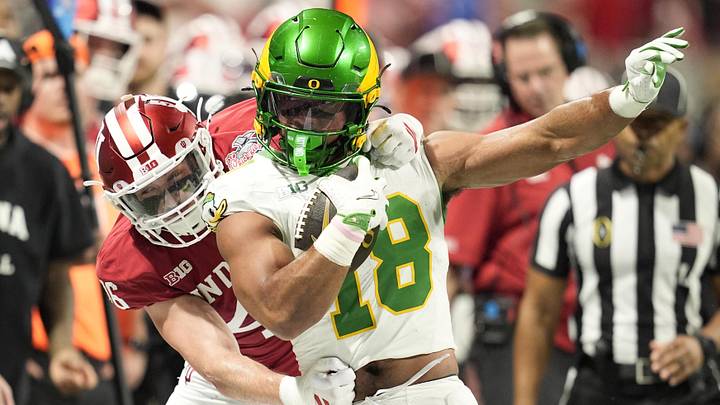 Jan 9, 2026; Atlanta, GA, USA; Oregon Ducks tight end Kenyon Sadiq (18) runs against Indiana Hoosiers linebacker Isaiah Jones (46)during the first quarter of the 2025 Peach Bowl and semifinal game of the College Football Playoff at Mercedes-Benz Stadium. Mandatory Credit: Dale Zanine-Imagn Imagesf