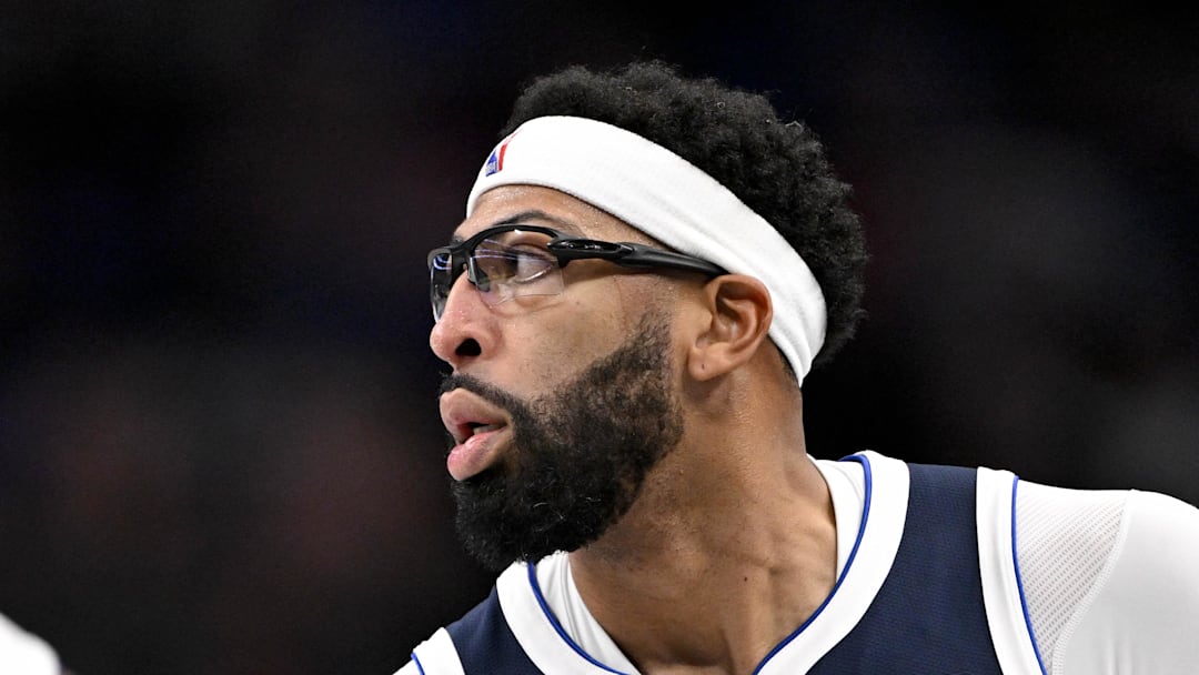 Dallas Mavericks forward Anthony Davis celebrates after making a three point basket against the Detroit Pistons.