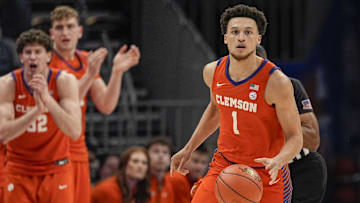 Mar 14, 2025; Charlotte, NC, USA; Clemson Tigers guard Chase Hunter (1) brings the ball up court against the Louisville Cardinals during the first half at Spectrum Center. Mandatory Credit: Jim Dedmon-Imagn Images
