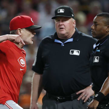 Jun 17, 2024; Pittsburgh, Pennsylvania, USA;  Cincinnati Reds manager David Bell (left) argues with home plate umpire Malachi Moore (right) before the bottom of the eighth inning against the Pittsburgh Pirates at PNC Park. The Pirates won 4-1. Mandatory Credit: Charles LeClaire-USA TODAY Sports