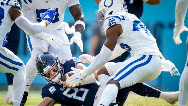 Tennessee Titans quarterback Will Levis (8) collides with Indianapolis Colts linebacker E.J. Speed (45) during the second quarter at Nissan Stadium in Nashville, Tenn., Sunday, Oct. 13, 2024.