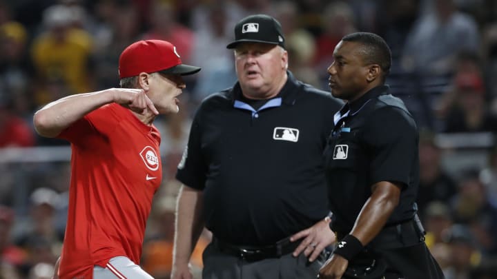 Jun 17, 2024; Pittsburgh, Pennsylvania, USA;  Cincinnati Reds manager David Bell (left) argues with home plate umpire Malachi Moore (right) before the bottom of the eighth inning against the Pittsburgh Pirates at PNC Park. The Pirates won 4-1. Mandatory Credit: Charles LeClaire-USA TODAY Sports