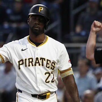 Sep 25, 2024; Pittsburgh, Pennsylvania, USA;  Pittsburgh Pirates designated hitter Andrew McCutchen (22) reacts to being called out on strikes on a check swing appeal by the Milwaukee Brewers during the second inning at PNC Park. Mandatory Credit: Charles LeClaire-Imagn Images