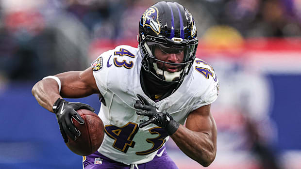 Baltimore Ravens running back Justice Hill (43) catches a touchdown pass during the second half against the New York Giants.