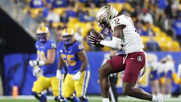 Nov 4, 2023; Pittsburgh, Pennsylvania, USA;  Florida State Seminoles defensive back Conrad Hussey (12) reacts after intercepting a pass against the Pittsburgh Panthers during the fourth quarter at Acrisure Stadium. The Seminoles won 24-7. Mandatory Credit: Charles LeClaire-Imagn Images