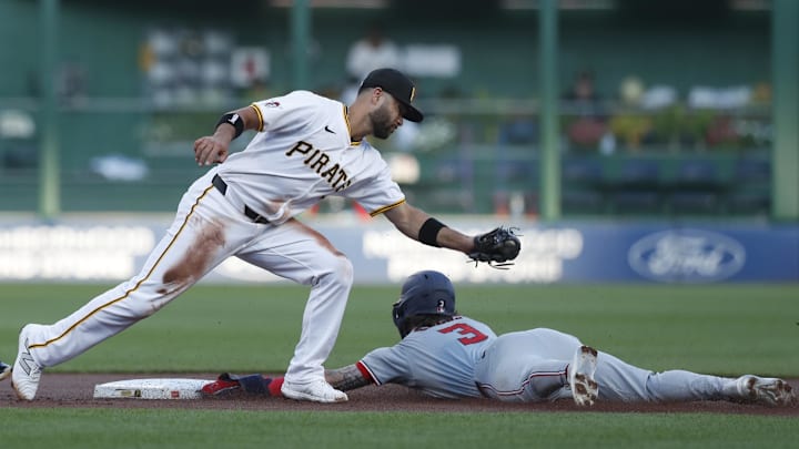 Sep 5, 2024; Pittsburgh, Pennsylvania, USA;  Washington Nationals right fielder Dylan Crews (3) steals second base ahead of a tag attempt by Pittsburgh Pirates shortstop Isiah Kiner-Falefa (7) during the first inning at PNC Park. Mandatory Credit: Charles LeClaire-Imagn Images