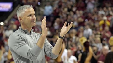 Mar 9, 2024; Tallahassee, Florida, USA; Florida State Seminoles head football coach Mike Norvell accepts the Bear Bryant coach of the Year award during a media timeout of a basketball game against the Miami Hurricanes at Donald L. Tucker Center. Mandatory Credit: Melina Myers-USA TODAY Sports