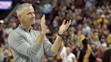 Mar 9, 2024; Tallahassee, Florida, USA; Florida State Seminoles head football coach Mike Norvell accepts the Bear Bryant coach of the Year award during a media timeout of a basketball game against the Miami Hurricanes at Donald L. Tucker Center. Mandatory Credit: Melina Myers-USA TODAY Sports