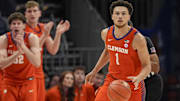 Mar 14, 2025; Charlotte, NC, USA; Clemson Tigers guard Chase Hunter (1) brings the ball up court against the Louisville Cardinals during the first half at Spectrum Center. 