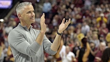 Mar 9, 2024; Tallahassee, Florida, USA; Florida State Seminoles head football coach Mike Norvell accepts the Bear Bryant coach of the Year award during a media timeout of a basketball game against the Miami Hurricanes at Donald L. Tucker Center. Mandatory Credit: Melina Myers-Imagn Images
