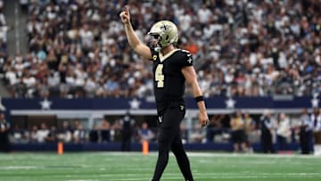 Sep 15, 2024; Arlington, Texas, USA; New Orleans Saints quarterback Derek Carr (4) reacts after a touchdown against the Dallas Cowboys in the second quarter at AT&T Stadium. Mandatory Credit: Tim Heitman-Imagn Images