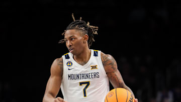 West Virginia Mountaineers guard Javon Small brings the ball up court during the first half against the Colorado Buffaloes.