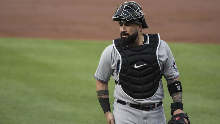 Miami Marlins catcher Sandy Leon (7) walks to home plate.