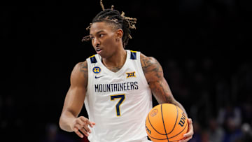 Mar 12, 2025; Kansas City, MO, USA; West Virginia Mountaineers guard Javon Small (7) brings the ball up court during the first half against the Colorado Buffaloes at T-Mobile Center. Mandatory Credit: William Purnell-Imagn Images
