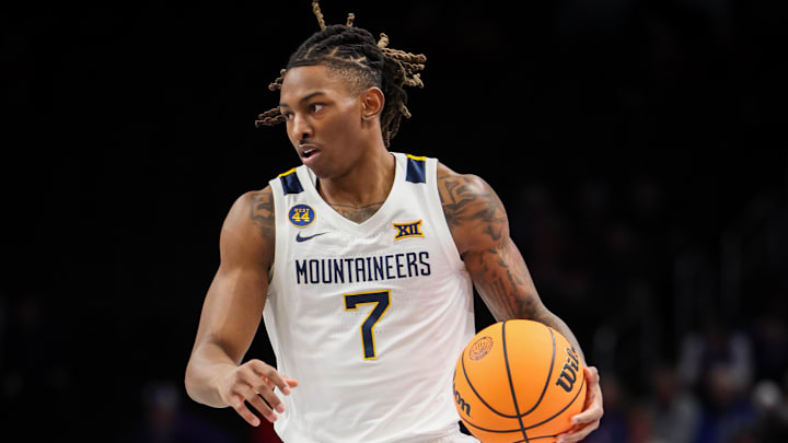 Mar 12, 2025; Kansas City, MO, USA; West Virginia Mountaineers guard Javon Small (7) brings the ball up court during the first half against the Colorado Buffaloes at T-Mobile Center. Mandatory Credit: William Purnell-Imagn Images Mar 12, 2025; Kansas City, MO, USA; West Virginia Mountaineers guard Javon Small (7) brings the ball up court during the first half against the Colorado Buffaloes at T-Mobile Center. Mandatory Credit: William Purnell-Imagn Images