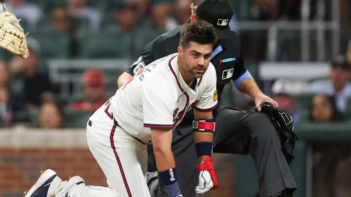 Atlanta Braves second baseman Whit Merrifield on ground after being hit in the head with a pitch against the Colorado Rockies on Tuesday.