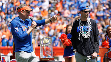 Apr 12, 2025; Gainesville, FL, USA; Florida Gators athletic director Scott Stricklin and Florida Gators head coach Todd Golden gesture during the National Championship celebration at Ben Hill Griffin Stadium. Mandatory Credit: Matt Pendleton-Imagn Images
