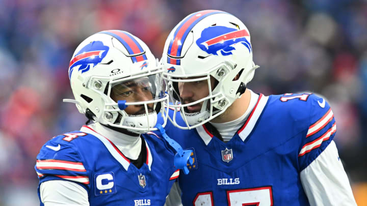 Dec 31, 2023; Orchard Park, New York, USA; Buffalo Bills quarterback Josh Allen (17) has a word with wide receiver Stefon Diggs (14) between plays in the third quarter game against the New England Patriots at Highmark Stadium. 